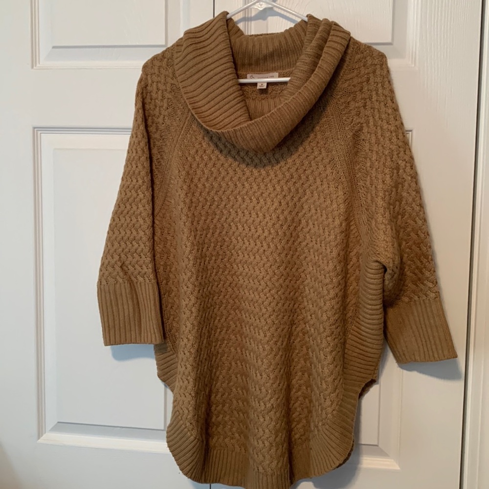 Tan cowl neck sweater.